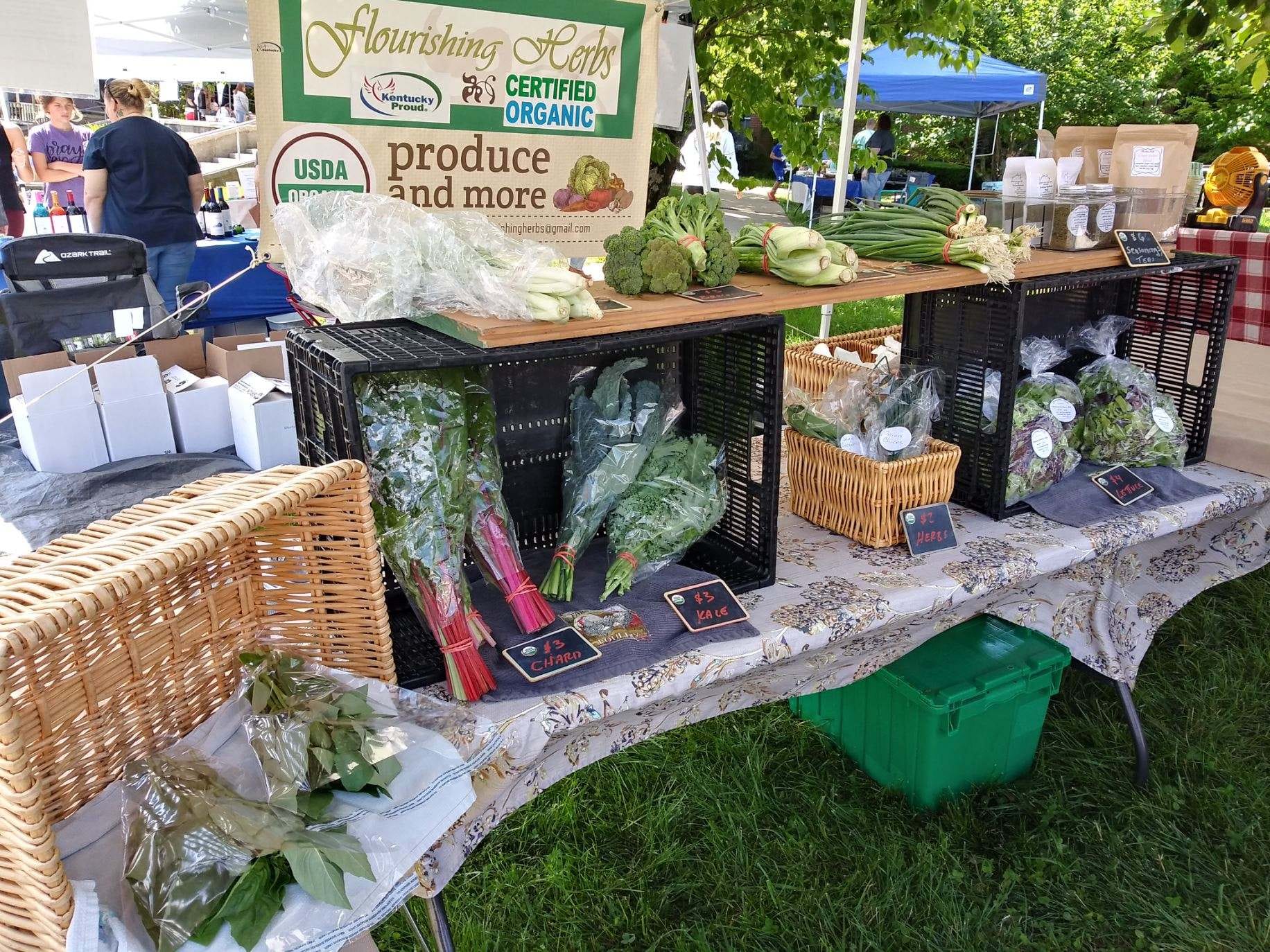 full farmers market table display from Flourishing Herbs Farm
